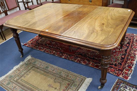 A Victorian mahogany dining table with two leaves and winder W.180cm